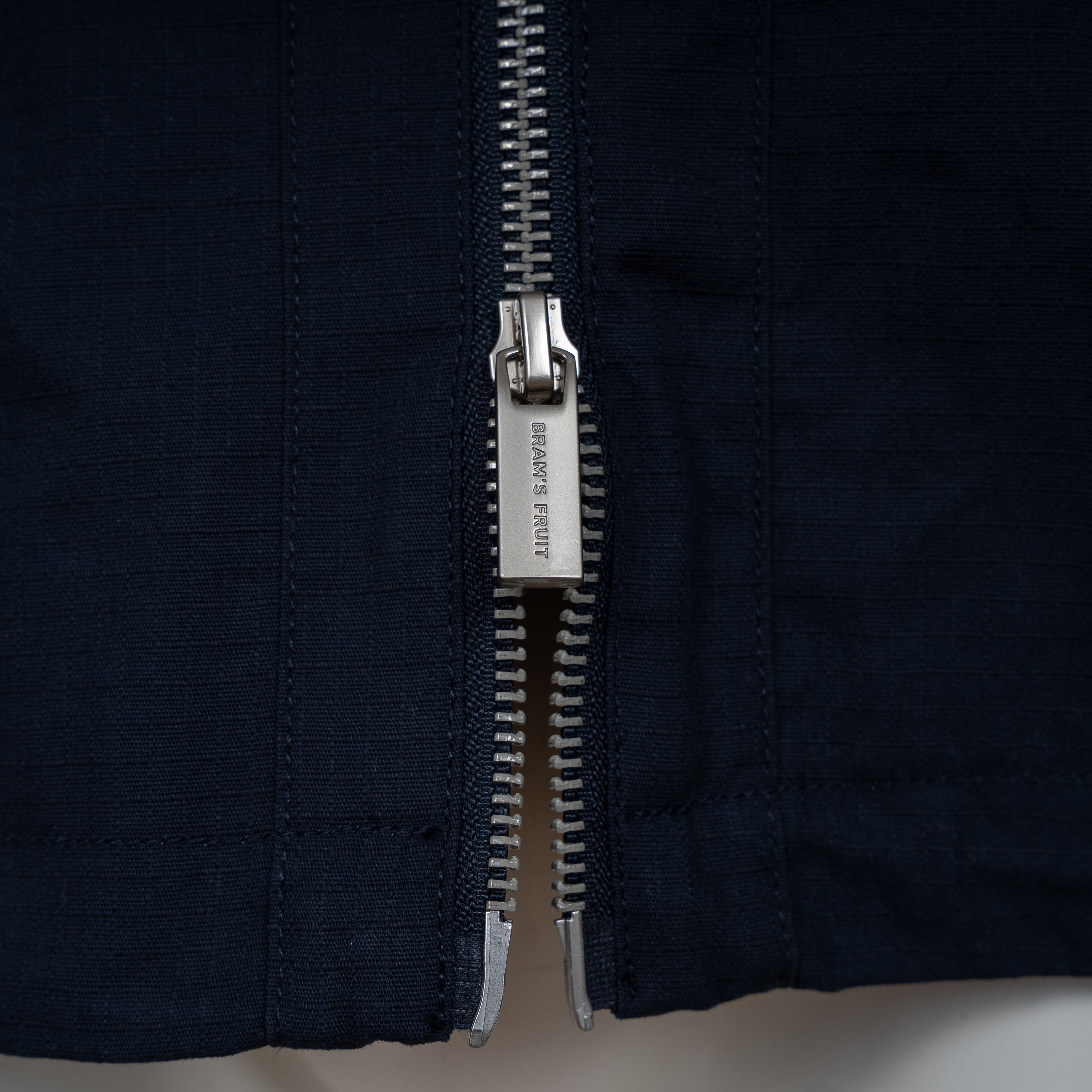 Bram's Fruit Jack Blauw | Ripstop Text Logo